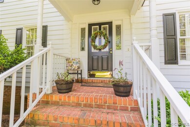 Brick steps lead to the traditional covered front