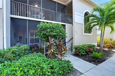 Property entrance with stucco siding and a sunroom