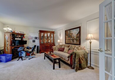 Spacious home office with French doors for privacy