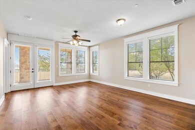 Living room overlooks lake and door out to covered