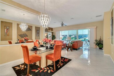Dining Area w/ Living Room & Enclosed Porch View
