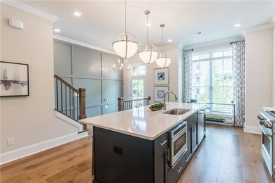 The Chamberlain has a elegant entrance welcoming you to this Beautiful kitchen that flows. Draped with huge windows to let in all the natural light! Not actual home.