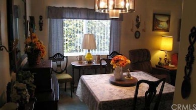 Dining area looking from entryway to kitchen.
