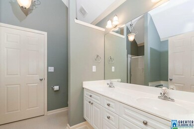 With vaulted ceiling, dual vanities, private potty