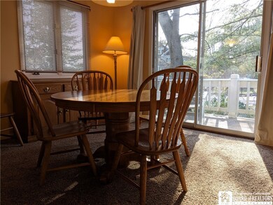 Dining room table expands to accommodate two more