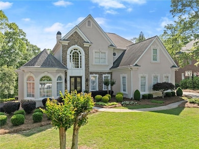 View of front facade with french doors, stucco sid