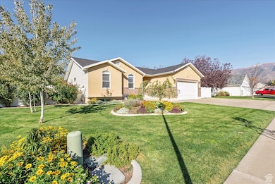View of front of home featuring driveway, stucco siding, and an attached garage