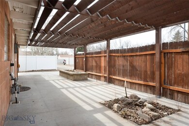 Large covered porch off kitchen with herb boxes