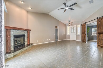 Unfurnished living room featuring a barn door, a c