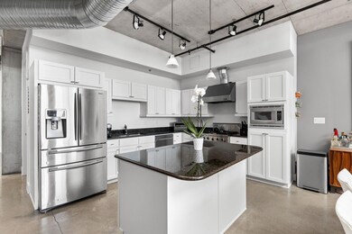 Kitchen featuring appliances with stainless steel