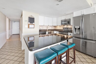 Kitchen with white cabinetry, stainless steel appl