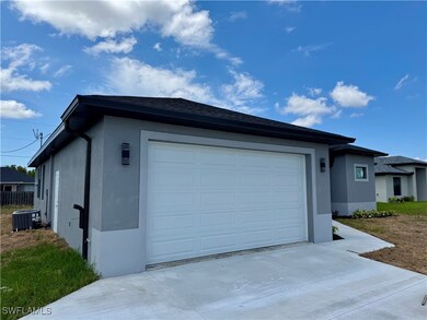 Garage with driveway and cooling unit