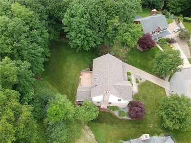 Arial shot of 207 Scotch Pine Court.  The wooded p