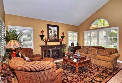 The formal living room is appointed with elegant, 