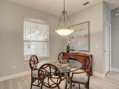 Dining room with light wood finished floors and baseboards