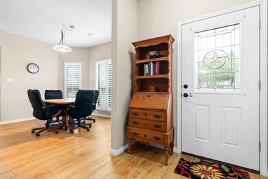 Office area featuring light wood-type flooring, b