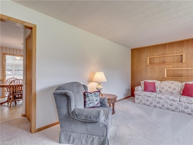 Large living room in the front of the home with bu