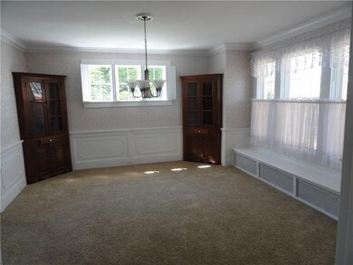 Formal dining area with beautiful china cupboards.