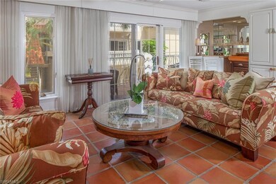 Living room with Balcony overlooking the pool