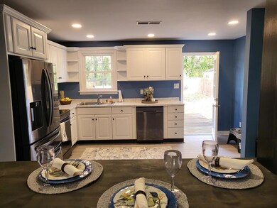 KITCHEN WITH DOOR TO THE DECK