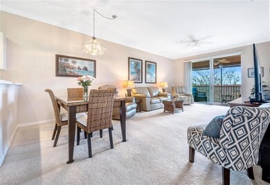 Dining space with crown molding, baseboards, and c