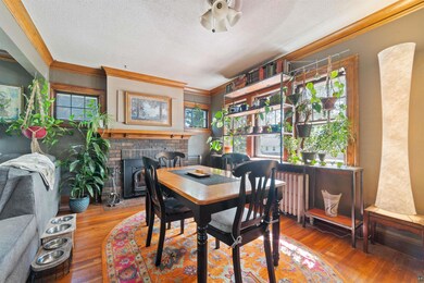 Dining room with a wealth of natural light, a fire
