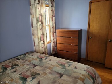 Bedroom featuring wood-type flooring