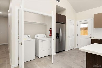 Washroom featuring washer and clothes dryer