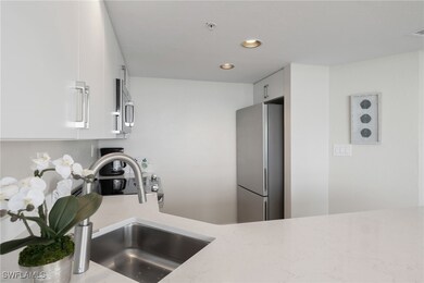 Kitchen with white cabinets, stainless steel appli