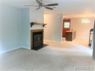 Family Room looking at fireplace, looking into Kit
