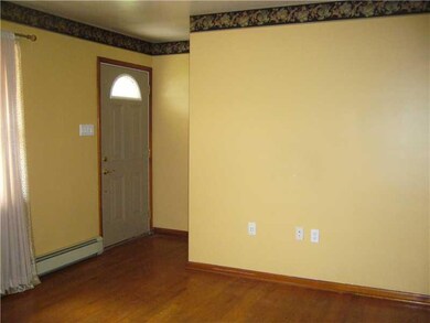 Living Room. Front door of house, leads into the l