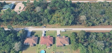 Aerial view of property's location with a heavily wooded​​‌​​​​‌​​‌‌​​​‌​​‌‌​‌‌​​​‌‌‌​​​​‌​​​​​‌ area