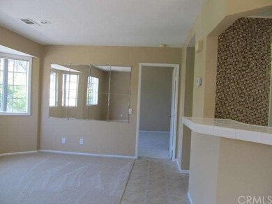 Breakfast bar on right living/dining on left.