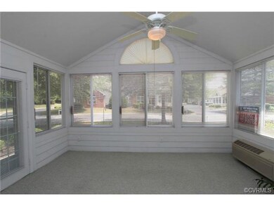 Bright Sunroom with Vaulted Ceiling