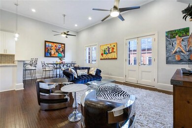 Living and dining areas with eat-in bar to the kit