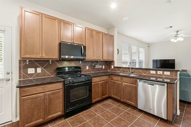 Another view of the kitchen area overlooking the family room.