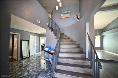 Stairway featuring baseboards, a high ceiling, and