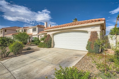 Mediterranean / spanish house featuring a tile roo
