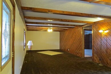 Gorgeous woodwork, bay window and ceiling fans.