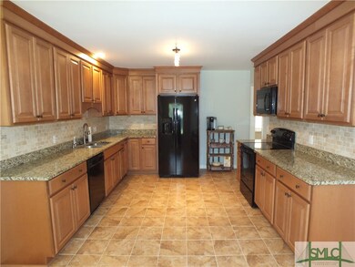 Upgraded cabinetry with full outs, granite counter