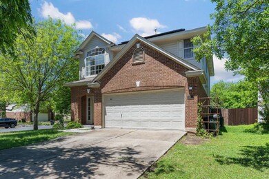 Traditional-style house featuring brick siding, d