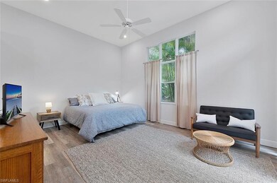 Bedroom featuring light wood-type flooring and cei