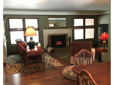 Living room and dining room combo with a fireplace