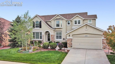 Three car tandem garage and lovely landscaping!