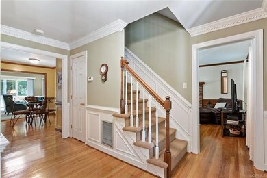 Front staircase with unusualy detailing.