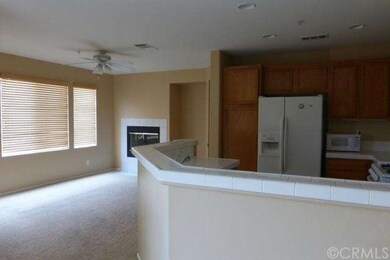 Living Room with fireplace opens to kitchen
