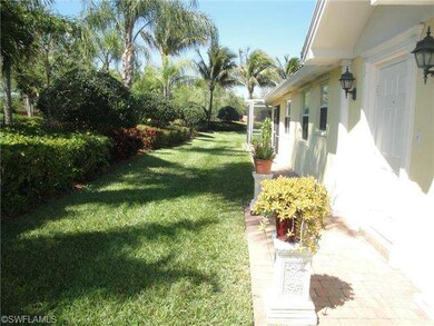 Wider side yard with lush lanscaping.