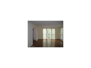 SUN~FILLED LIVING ROOM WITH GLEAMING HARDWOOD FLOO