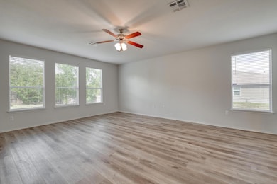 Spare room featuring light wood-style floors, a c