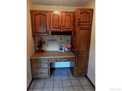 Kitchen. Side nook off kitchen has more cabinet sp